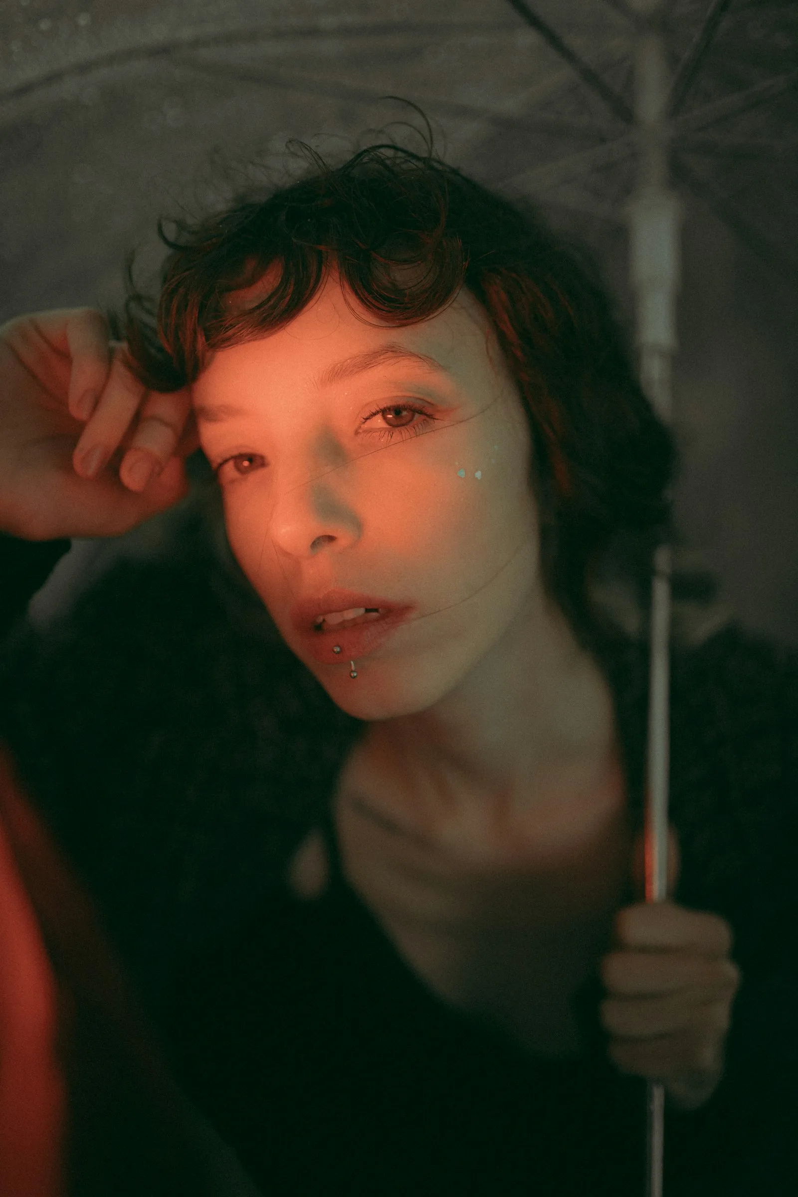 A close portrait in the rain at night