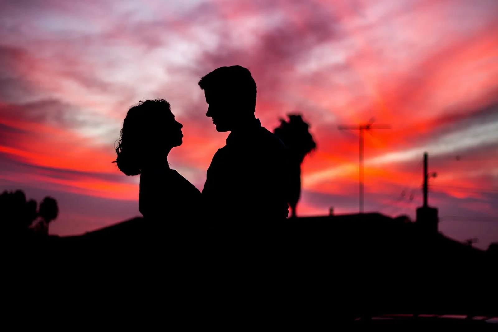 A couple silhouetted against the sunset