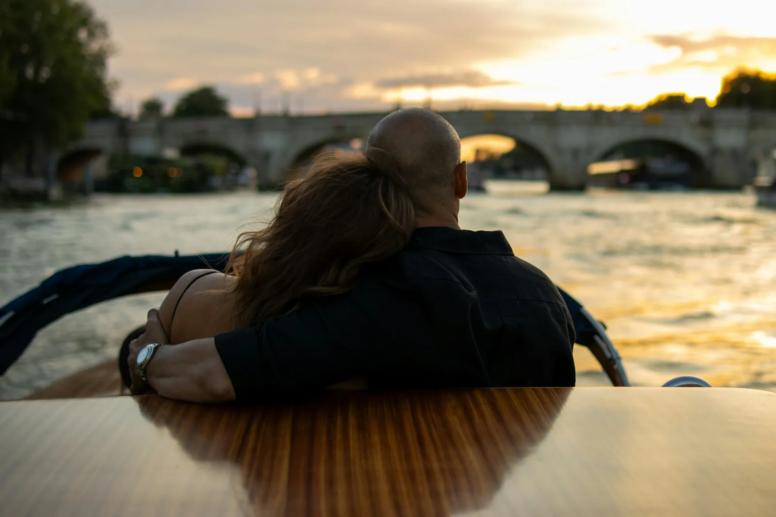 A couple close together in golden light